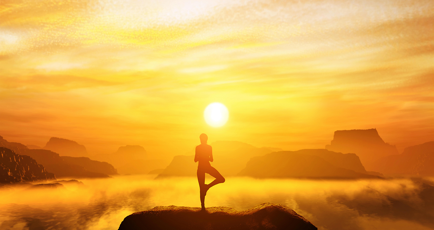 Woman-meditating-above-mountain-clouds-on-sun-down.jpg